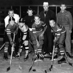From the collections of the St. Louis Mercantile Library
at the University of Missouri-St. Louis
This photo originally was published in the St. Louis Globe-Democrat on Nov. 7, 1961. It shows players and coaches from the very first youth hockey league in St. Louis, at Steinberg Rink in Forest Park. They are, first row, from left: John Burger Jr., Ed Signaigo, Terry McKenna and Scott Christofferson; second row, from left: Bouncer Taylor, Shrimp McPherson, Eddie Olson and George Milligan. In the photo caption so long ago, the Globe had the wrong first name for McKenna. Perhaps the photographer heard it wrong or wrote it wrong, or maybe the copy editor read it wrong. Whatever the case, almost 52 years later, this serves as a correction.